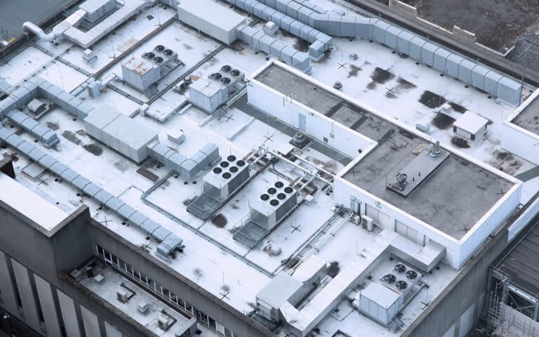 Commercial rooftop with multiple HVAC units and mechanical equipment