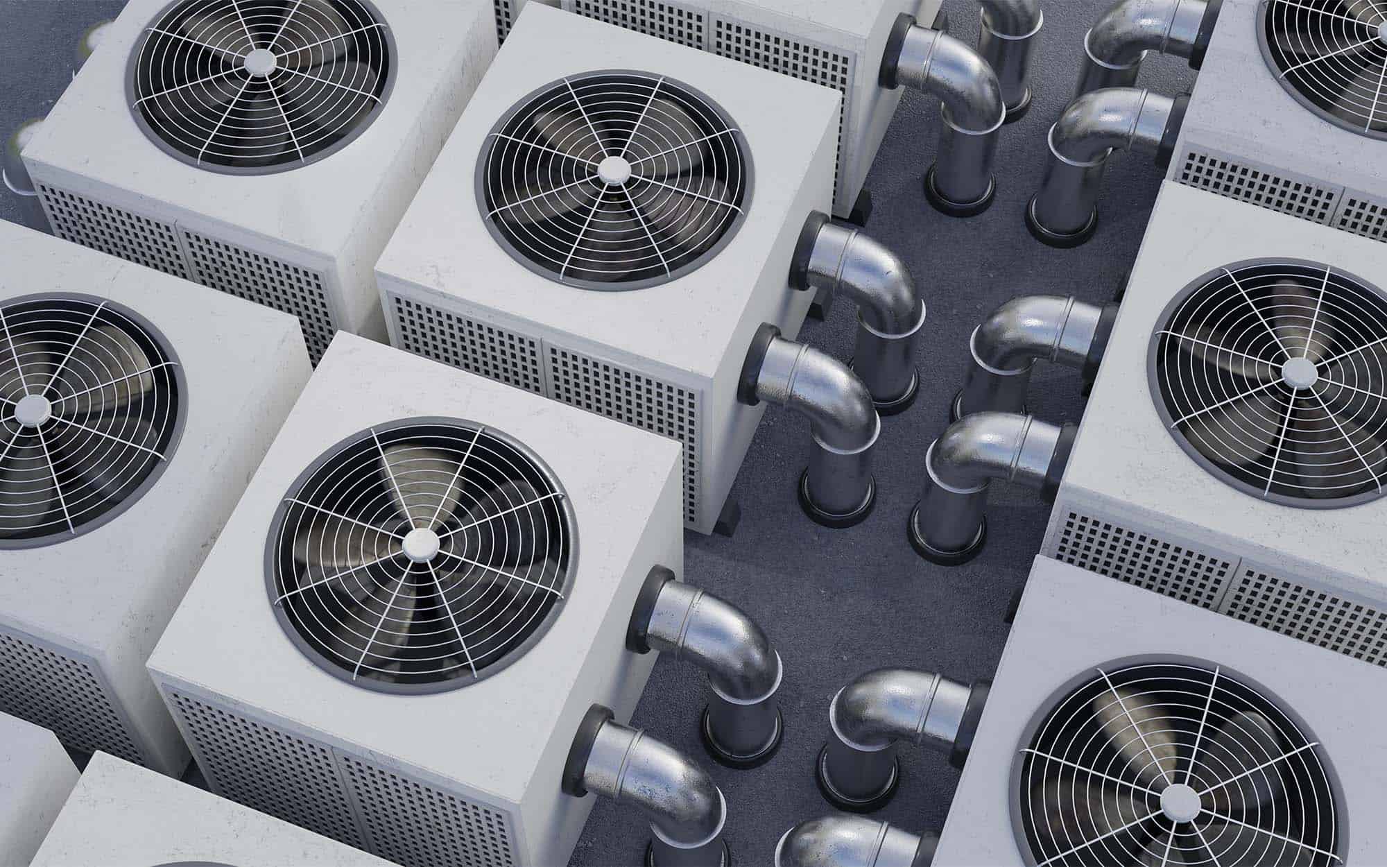 Multiple HVAC outdoor units with ventilation fans and ductwork viewed from above