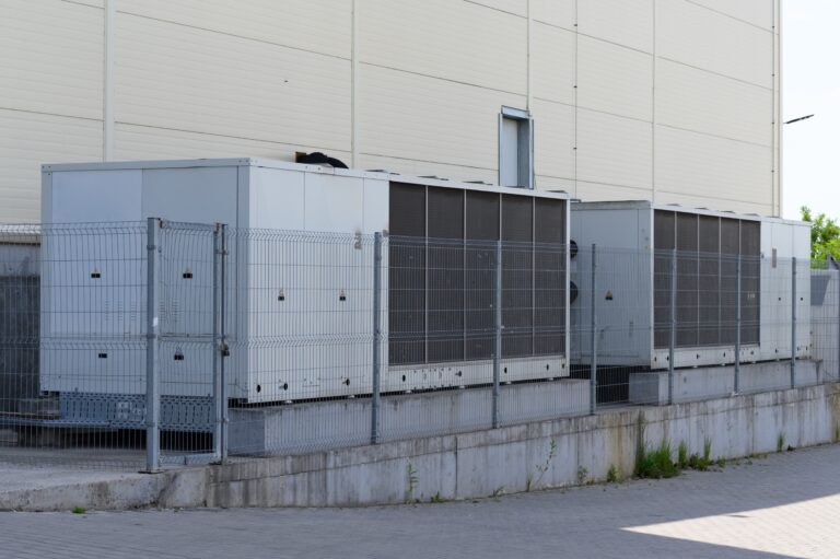 Commercial HVAC units outside building in spring weather