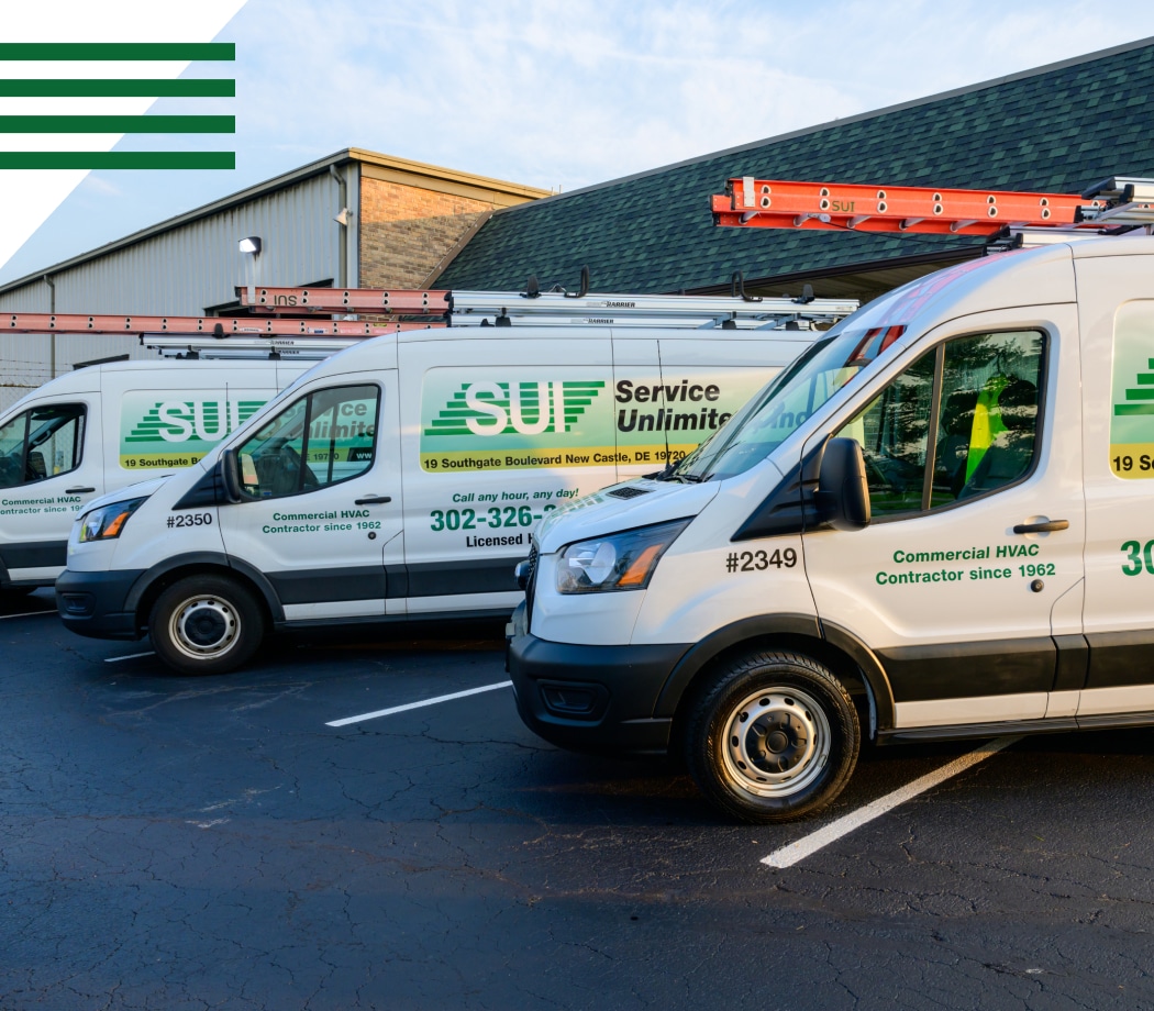 Service Unlimited commercial HVAC contractor vans parked at facility
