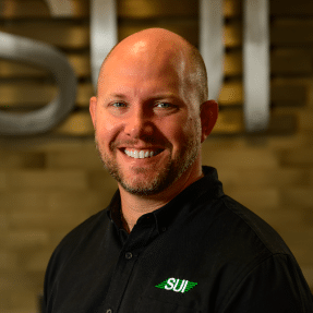 Brian Martinenza, Jr. Service Unlimited team member in black SUI polo shirt
