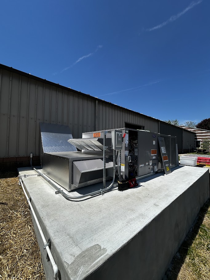 Installation of a 10-ton and a 27.5-ton packaged HVAC